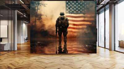 A soldier, gripping a rifle, stands resolute before a waving US flag, illuminated by the warm glow of a sunset. Wall mural