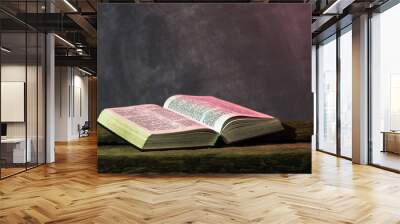 Bible on a old oak wooden table. Beautiful dark background.Religion concept Wall mural