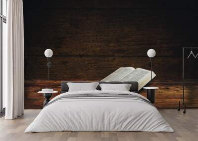 Bible on a old wooden table background. Wall mural