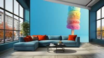 Bright colored popsicles on a blue background symbolize the coolness of summer. Wall mural