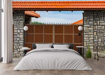 brown forged automatic gates in the cottage Wall mural