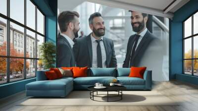 Cheerful executives in formal attire brainstorm business strategies in a corporate environment Wall mural