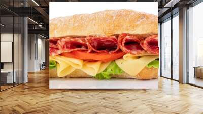 Ciabatta sandwich with lettuce, tomatoes prosciutto and cheese isolated on white background Wall mural