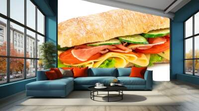 Ciabatta sandwich with lettuce, tomatoes prosciutto and cheese isolated on white background Wall mural