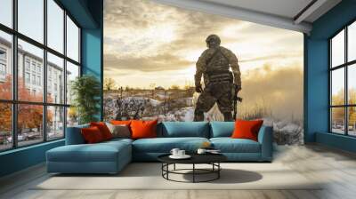 exhausted army soldier Man after the battle walks in winter desert view from the back. commandos with full equipment helmet and gun view from the back. Modern warfare army soldier and battlefield Wall mural