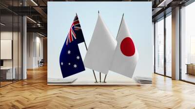 Flags of Australia and Japan with a white flag in the middle Wall mural