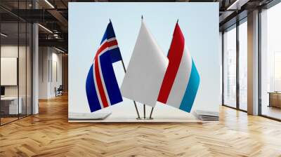 Flags of Iceland and Luxembourg with a white flag in the middle Wall mural