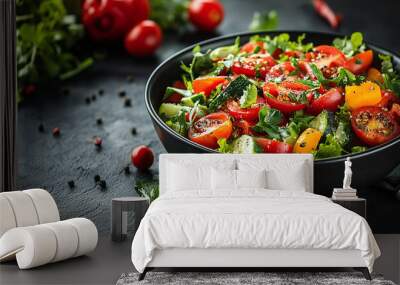 Fresh vegetable salad bowl with tomatoes, peppers, and herbs on a dark background Wall mural