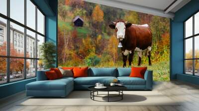 mountain village. autumn landscape with brown cow on pasture Wall mural