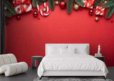 Red Christmas background with fir ornaments and holiday gifts Wall mural