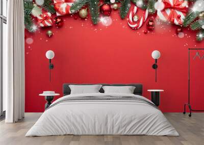 Red Christmas background with fir ornaments and holiday gifts Wall mural