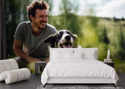 A man sharing a laugh with his energetic Border Collie while playing fetch Wall mural