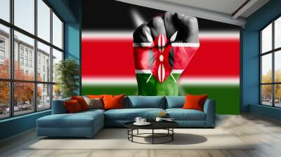 Man hand fist of KENYA flag painted. Close-up. Wall mural