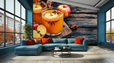 Maple syrup autumn cocktails. Boozy strong alcohol, non-alcoholic mocktail drinks with apple cider, liqueur and spices, on dark wooden background copy space Wall mural