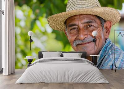 Mexican grandfather smiling at camera. adult latino with hat on a sunny day Wall mural