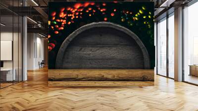 Old wooden barrel and wood table.  Beautiful light bokeh background. Wall mural