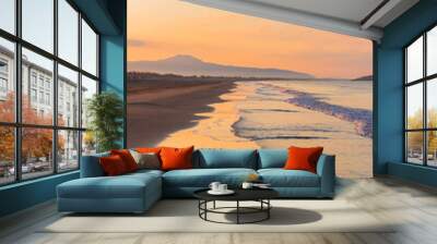 Picturesque Mediterranean seascape in Turkey. Amazing sunrise on Patara beach, Mugla Province. 
Morning orange clouds reflected in calm water. Wall mural