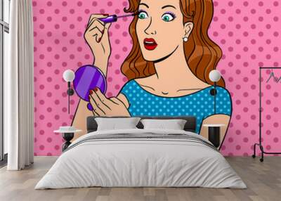 Girl paints eyelashes pop art vector Wall mural