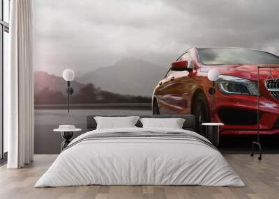 red business car speeding on a mountain highway with motion blur Wall mural