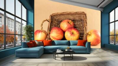 Several red apples in a basket on kraft paper, macro. Wall mural