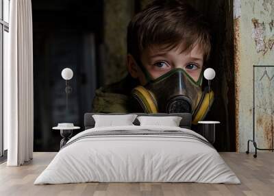 Young boy in a gas mask stands alone in an abandoned building, facing a post apocalyptic world of pollution and danger Wall mural