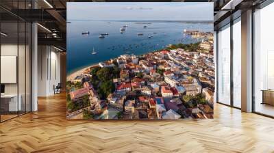 Zanzibar Aerial Shot of Stone Town Beach with Traditional Dhow Fisherman Boats in the Ocean at Sunset Time Wall mural