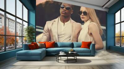 Concept of wealth and success. Couple of rich and good-looking young people Wall mural