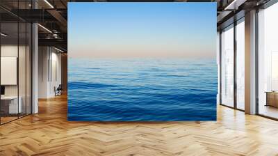 Sea waves on a background of blue sky Wall mural