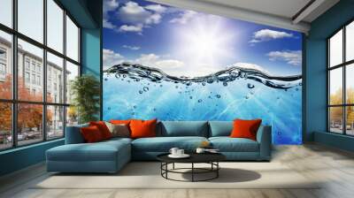 The waves,the water line,on the background of a sunshine. Wall mural