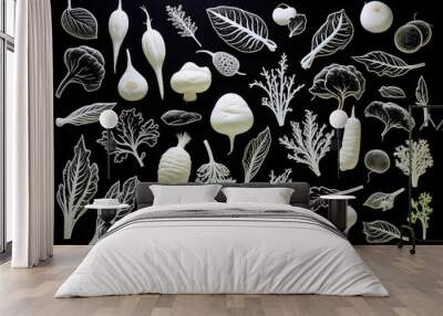 A simple layout of white root vegetables and lettuce leaves on a black background. Wall mural