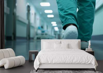 Legs of a doctor or nurse walking along an empty hospital corridor. Wall mural