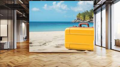 Yellow hand luggage suitcase for travel on the sandy beach of a tropical island. Vacations and visiting tourist places. Wall mural