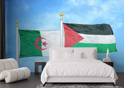 Algeria and Palestine two flags on flagpoles and blue sky Wall mural