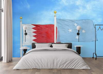 Bahrain and Micronesia two flags on flagpoles and blue sky Wall mural