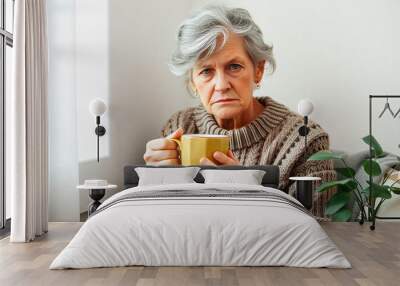 grumpy old woman holding coffee cup Wall mural