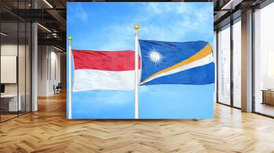 Indonesia and Marshall Islands two flags on flagpoles and blue cloudy sky Wall mural