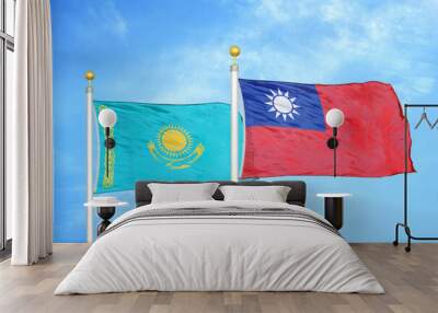 Kazakhstan and Taiwan two flags on flagpoles and blue sky Wall mural