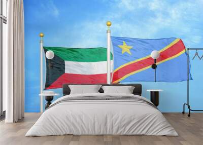 Kuwait and Congo Democratic Republic two flags on flagpoles and blue sky Wall mural