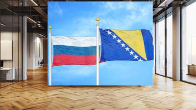 Russia and Bosnia and Herzegovina  two flags on flagpoles and blue cloudy sky Wall mural