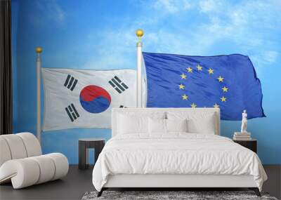 South Korea and European Union two flags on flagpoles and blue cloudy sky Wall mural