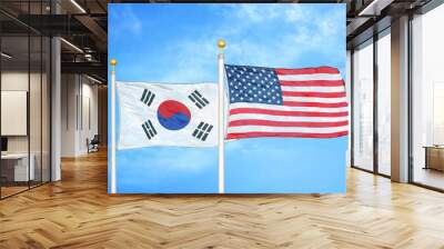 South Korea and United States two flags on flagpoles and blue cloudy sky Wall mural