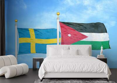 Sweden and Jordan two flags on flagpoles and blue sky Wall mural