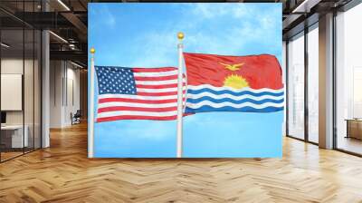 United States and Kiribati two flags on flagpoles and blue cloudy sky Wall mural