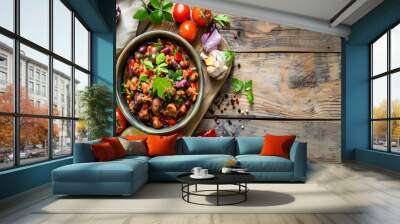 Bowl with delicious chili turkey and fresh vegetables on wooden table Wall mural