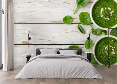 Bowls with delicious spinach soup on table Wall mural