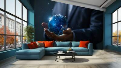 Global innovation. Businessman holding virtual planet on dark blue background, closeup Wall mural