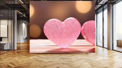 hearts on a table in front of a bokeh effect background banner for valentine day holiday card Wall mural