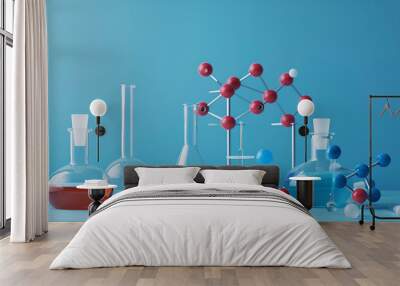 Laboratory glassware and molecule model on blue background Wall mural