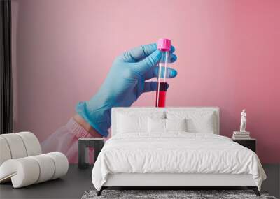 Laboratory worker's hand in rubber glove holding test tube with blood sample on light background Wall mural