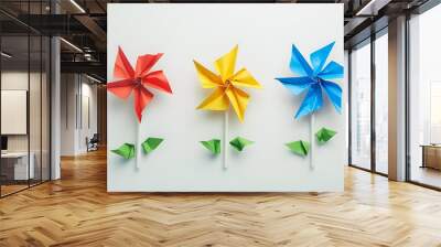 pinwheel or windmill paper origami isolated on white background simple starter craft for kids for weekend entertainment. ESG and Clean Energy Concept. Wind Turbine Paper into the Sky. Decrease Carbon Wall mural